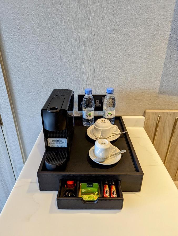 Citadines Abha Aparthotel Bagian luar foto A Nespresso coffee machine in a hotel room