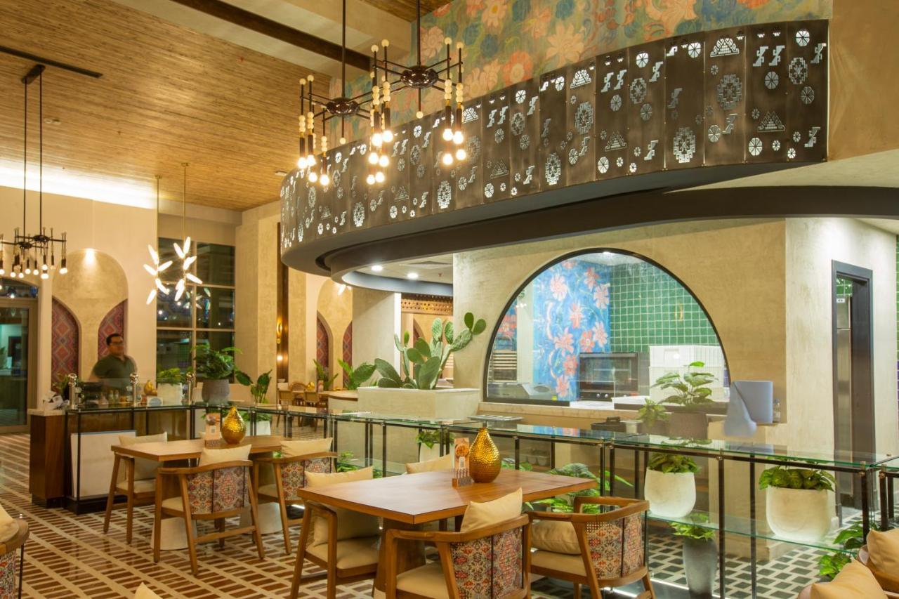 Citadines Abha Aparthotel Bagian luar foto The interior of the restaurant